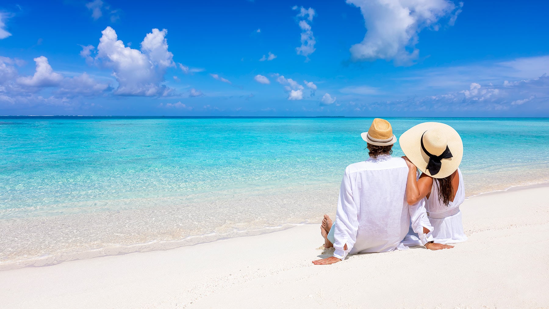 Romantic Couple Relaxing On The Beach